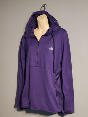 This purple Adidas Climawarm Transition Half-Zip Hoodie is a high-performance